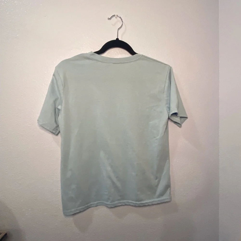 Cotton light blue shirt with wave design on front. - Picture 3 of 3